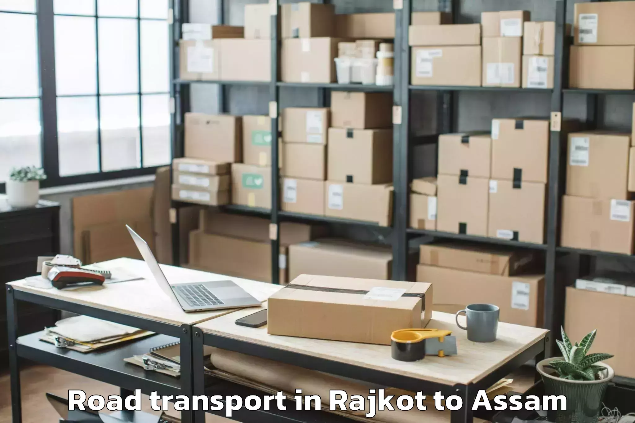 Hassle-Free Rajkot to Kharupetia Road Transport